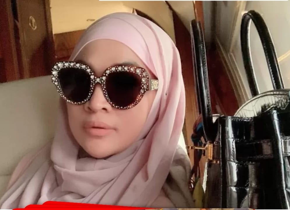 Gaya modis Nursam Jhonlin dengan tas Hermes miliaran rupiah.(Ist)